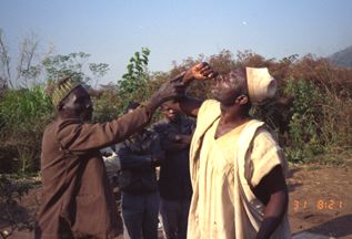 cd1709-82-f504-21.jpg Closing rites, the two officiants treat each other