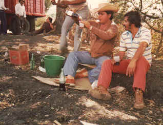 Arturo Herrera drinks with peon.jpg (86349 bytes)