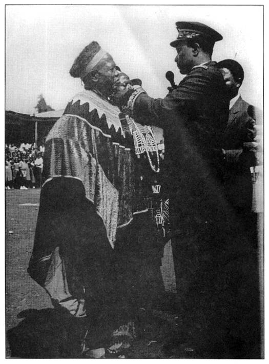 His Highness the Fon of Bum being decorated by the Governor of the North-West Province